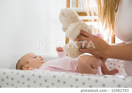 Mother playing with her baby 32062783