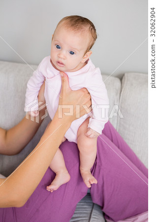 Mother playing with her baby 32062904
