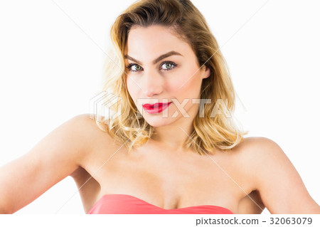 Portrait of beautiful woman posing against white background Portrait of beautiful woman posing against white background 32063079