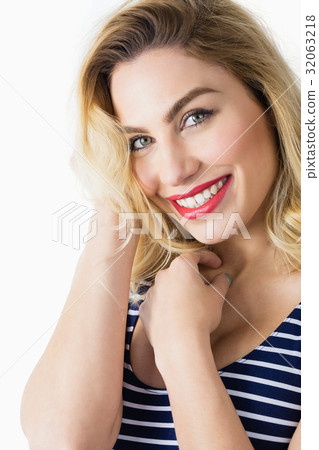 Portrait of beautiful woman posing against white background Portrait of beautiful woman posing against white background 32063218