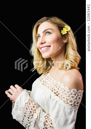 Beautiful smiling woman against black background 32063441
