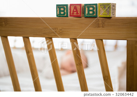Alphabet blocks on baby bed Alphabet blocks on baby bed 32063442