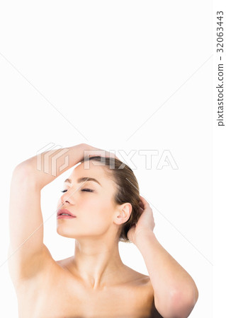 Beautiful woman posing against white background Beautiful woman posing against white background 32063443