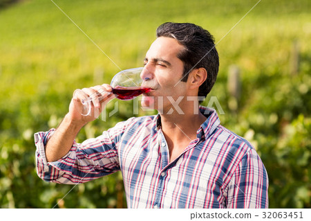 Male vintner having wine 32063451