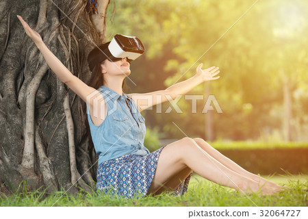 asian woman enjoy VR headset glasses device 32064727