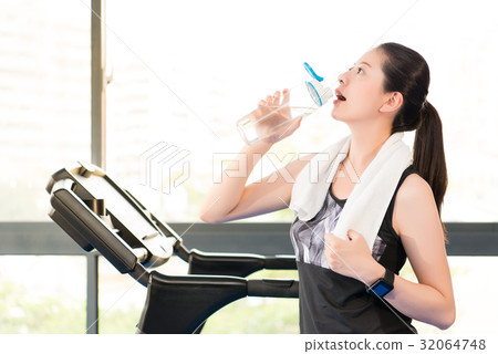 Beautiful asian woman rest drinking water bottle Beautiful asian woman rest drinking water bottle 32064748