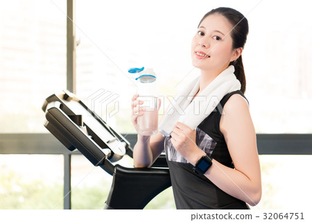 Beautiful asian woman rest holding water bottle 32064751