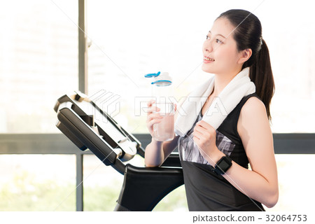 Beautiful asian woman rest holding water bottle 32064753
