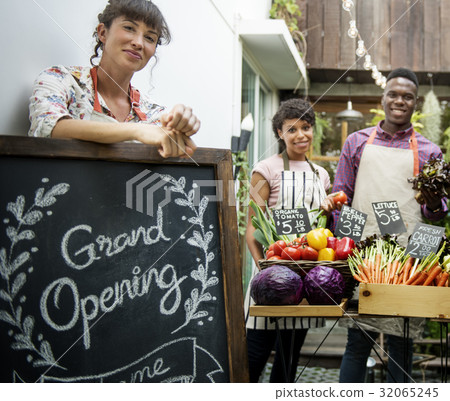 Diverse People with Grand Opening Sign First Day of Business 32065245