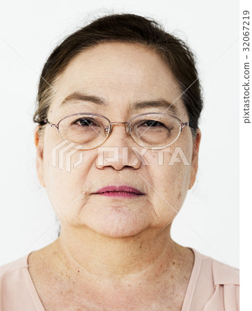 Lonely senior adult woman casual studio portrait 32067219
