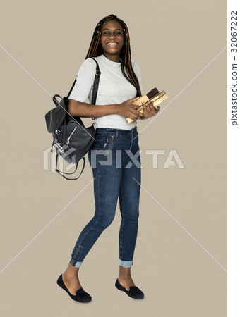 African girl student smiling and holding textbook African girl student smiling and holding textbook 32067222