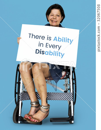 Senior adult woman on wheelchair holding motivation banner 32067508