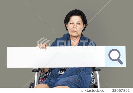 Senior adult woman on wheelchair holding searching banner Senior adult woman on wheelchair holding searching banner 32067801