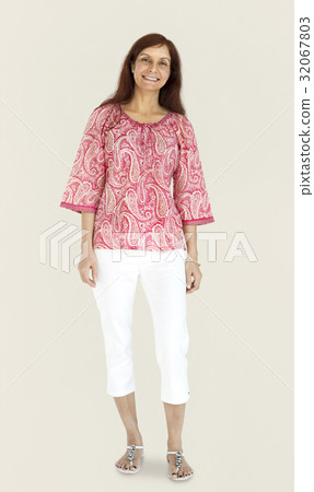 Woman standing smiling studio portrait Woman standing smiling studio portrait 32067803