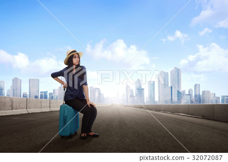 Unhappy beautiful asian traveler woman 32072087