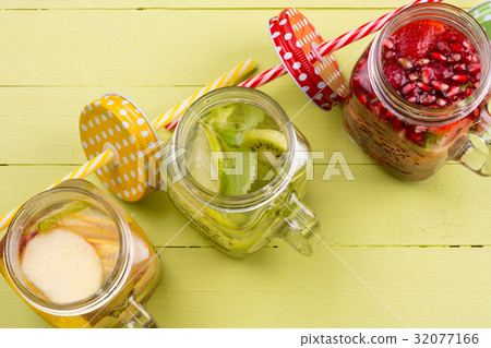 Fresh fruits flavored water in jars Fresh fruits flavored water in jars 32077166