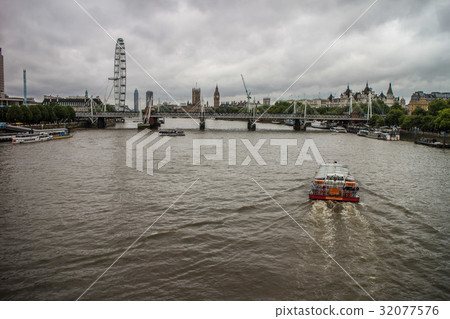 London: Thames River and London Eye seen from the Waterloo Bridge London: Thames River and London Eye seen from the Waterloo Bridge 32077576