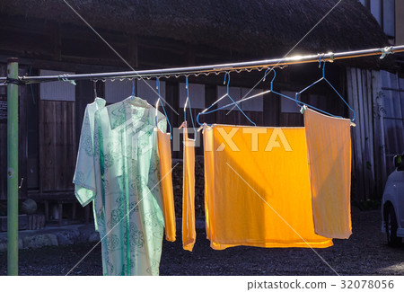 Drying clothes under sun light 32078056