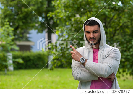 Handsome young man at the park on sunny day Handsome young man at the park on sunny day 32078237
