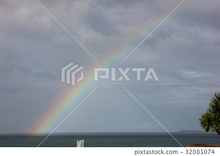 Rainbow rising from the sea 32081074