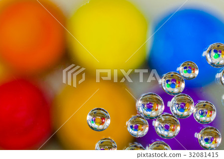 colorful bubble above violet plastisol ink in can. 32081415