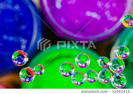 colorful bubble above green plastisol ink in can. 32081418