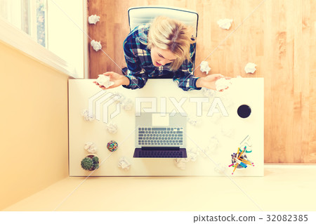 Young woman with crumpled paper creativity concept 32082385