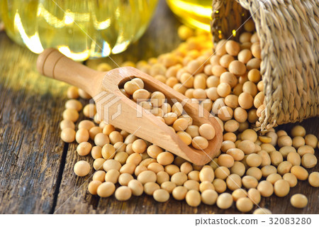 soy bean and oil on wood table soy bean and oil on wood table 32083280