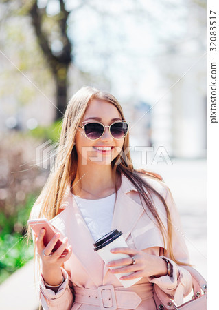 Upper class woman . Fashionable woman texting Upper class woman . Fashionable woman texting 32083517
