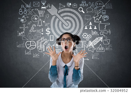 Shocked woman with dart target and business icons 32084952