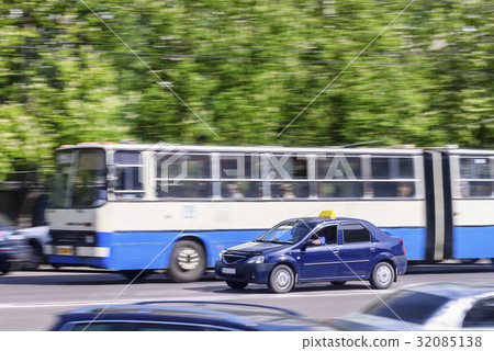 Bus rides on city road with ghost effect Bus rides on city road with ghost effect 32085138