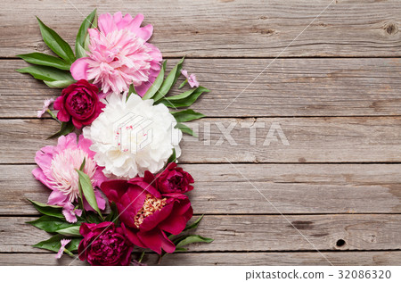 Garden peony flowers on wood Garden peony flowers on wood 32086320