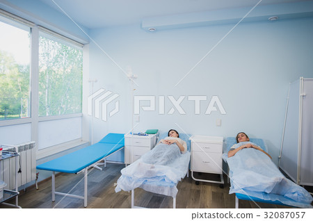 Female patient sleeping in medical bed at the 32087057