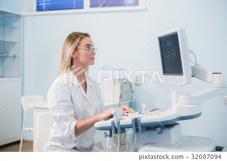 Smiling doctor, ultrasound. The doctor performed Smiling doctor, ultrasound. The doctor performed 32087094