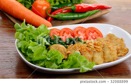 Fish dish - fried fish fillet with vegetables 32088899