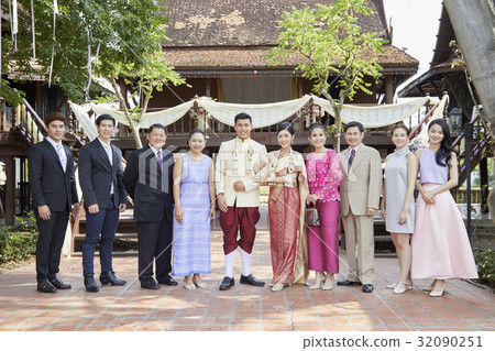 A picture of a group smiling at a wedding ceremony 32090251