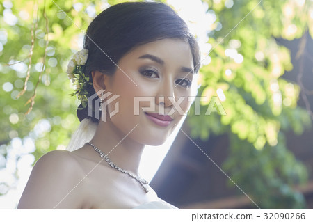 A photo of a beautiful bride smiling. 32090266