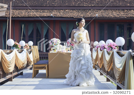 A portrait of a bride looking at something. 32090271