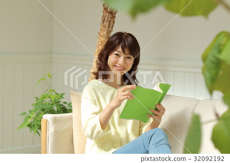 A woman reading A woman reading 32092192