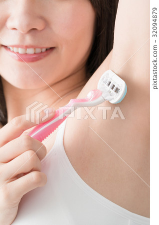 Women shaving unwanted hair aside 32094879