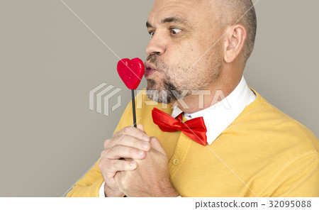 Caucasian Man Holding Heart Shape Lollipop Caucasian Man Holding Heart Shape Lollipop 32095088