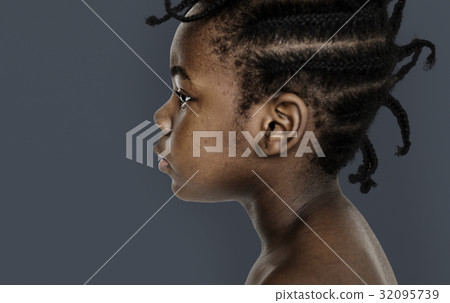 African little girl bare chest studio portrait in side view 32095739