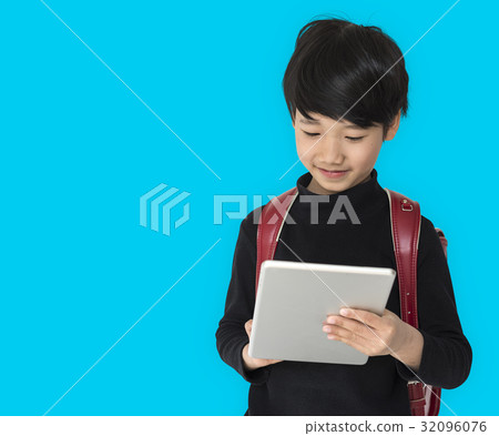 A boy with a backpack and tablet. A boy with a backpack and tablet. 32096076