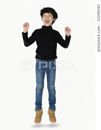 A happiness boy is jumping A happiness boy is jumping 32096082