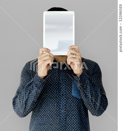 Man holding blank digital tablet cover face studio portrait Man holding blank digital tablet cover face studio portrait 32096089