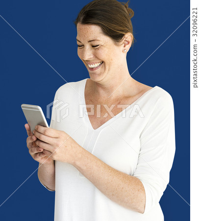 Caucasian Woman is Smiling with Smartphone Caucasian Woman is Smiling with Smartphone 32096221