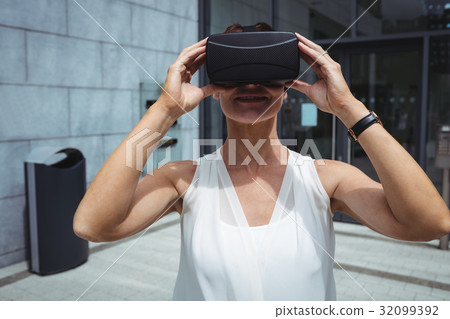 Woman using reality virtual headset 32099392