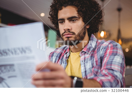 Man reading newspaper Man reading newspaper 32100446