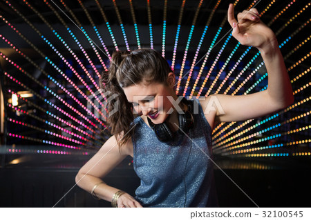 Pretty female DJ playing music 32100545