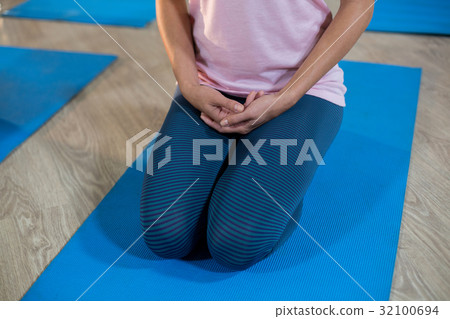 Woman performing yoga 32100694